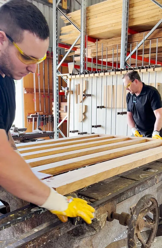 Two Joiners custom making timber door togther